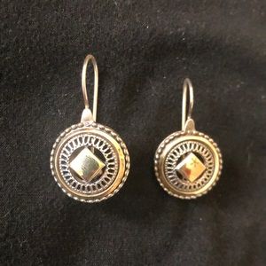 Gold and silver circle earrings.